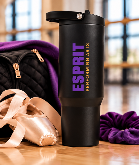 Esprit Performing Arts 32 oz HydroJug with vertical purple and gold logo in dance studio